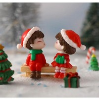 Figurines Enfants de Noël sur un banc